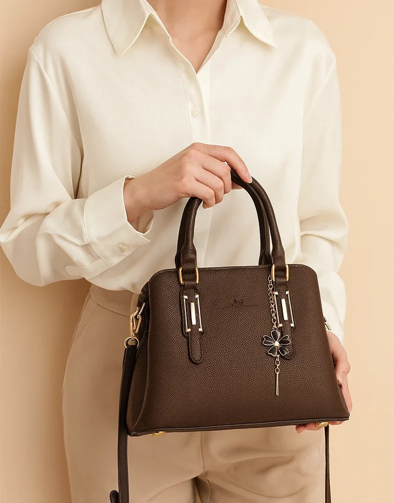 Liora Camellia Medium Brown Pebbled Tote Bag with Floral Charm