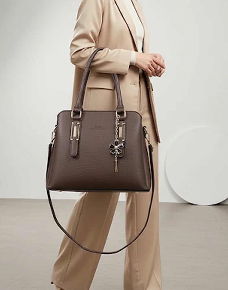 Liora Camellia Medium Brown Pebbled Tote Bag with Floral Charm